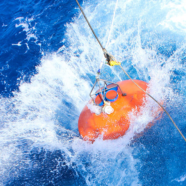 buoy being deployed in ocean